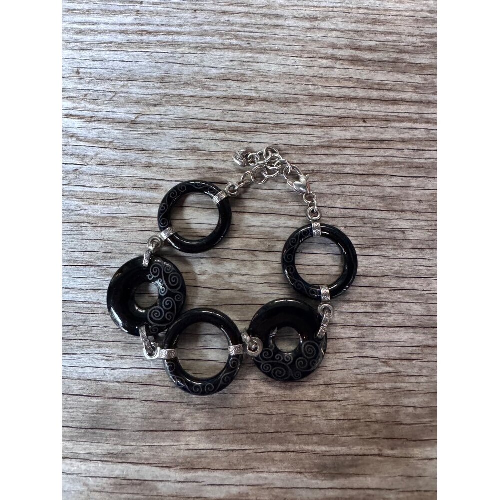 Black Onyx Brighton Swirl Motif Link Bracelet With Intricate Silver Detailing